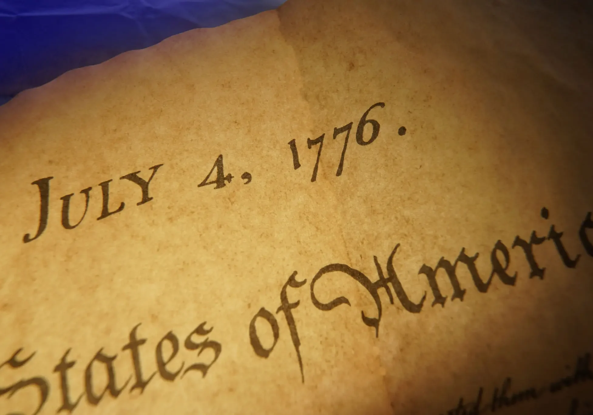 Close-up of old parchment showing the date July 4, 1776.